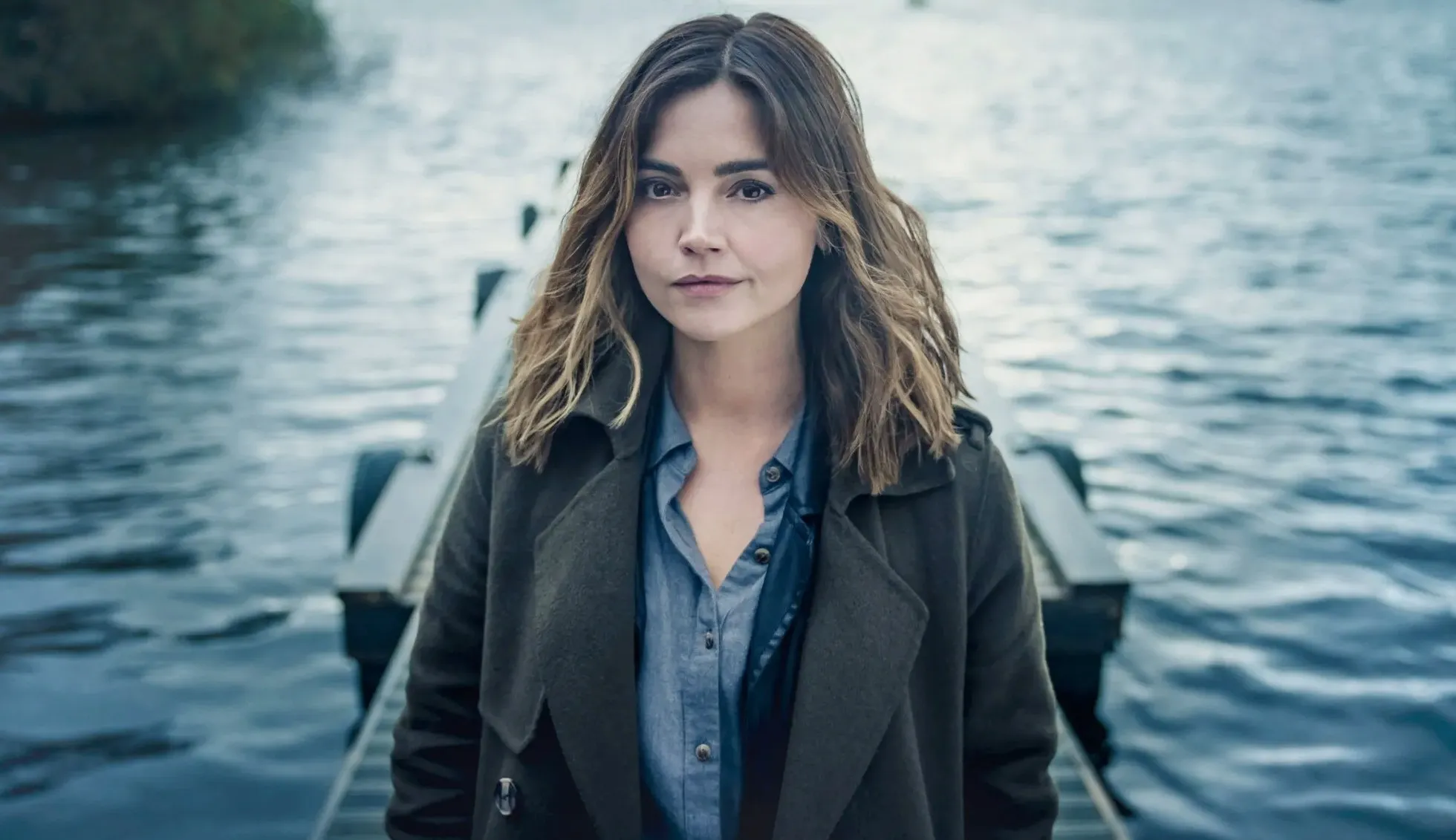 A woman looks at a camera in The Jetty.