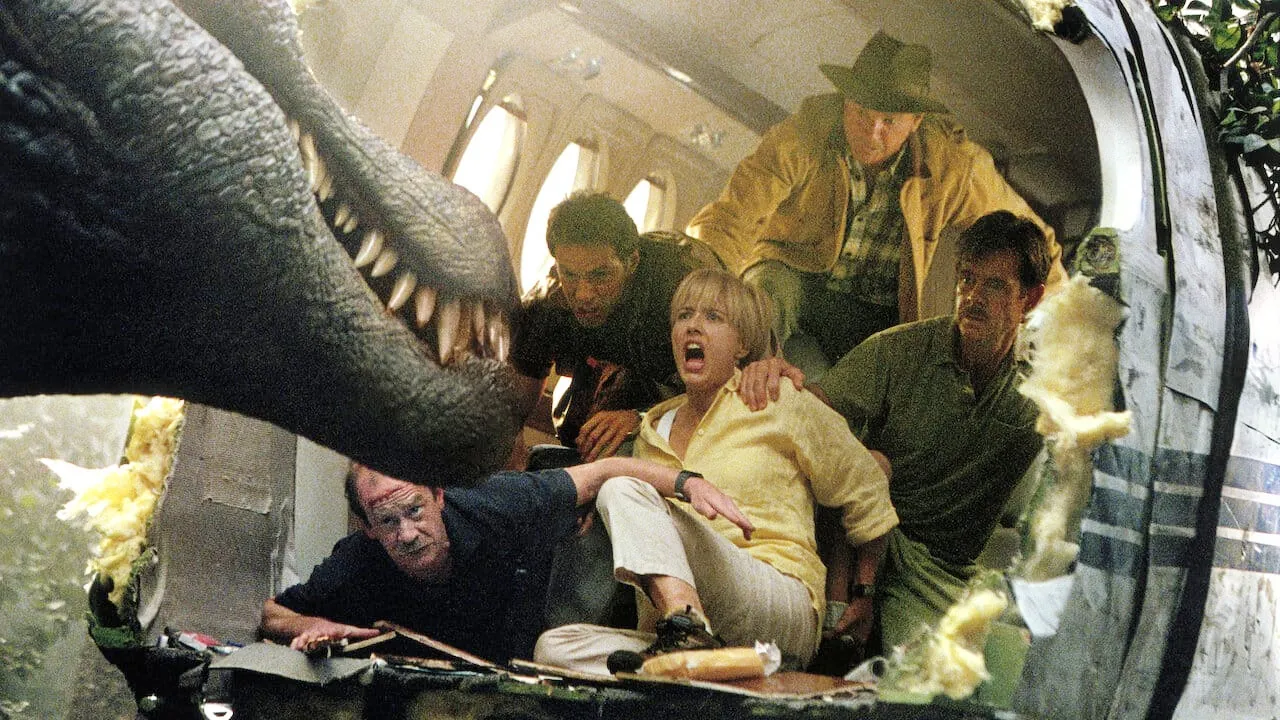 A group of people look at a dinosaur in Jurassic Park III.