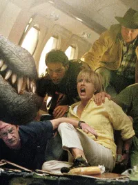 A group of people look at a dinosaur in Jurassic Park III.