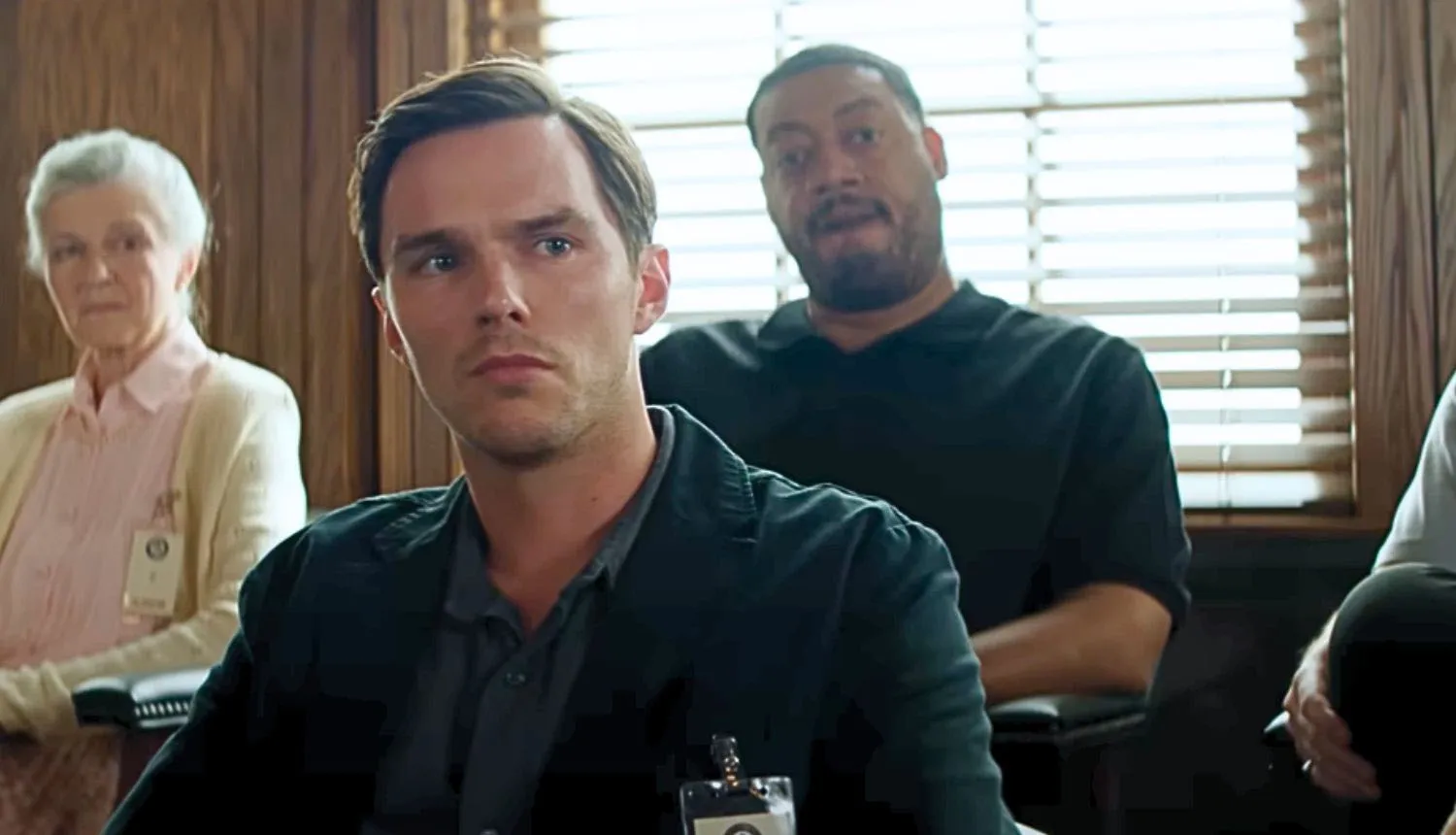 Nicholas Hoult sits in the jury box in Juror #2.