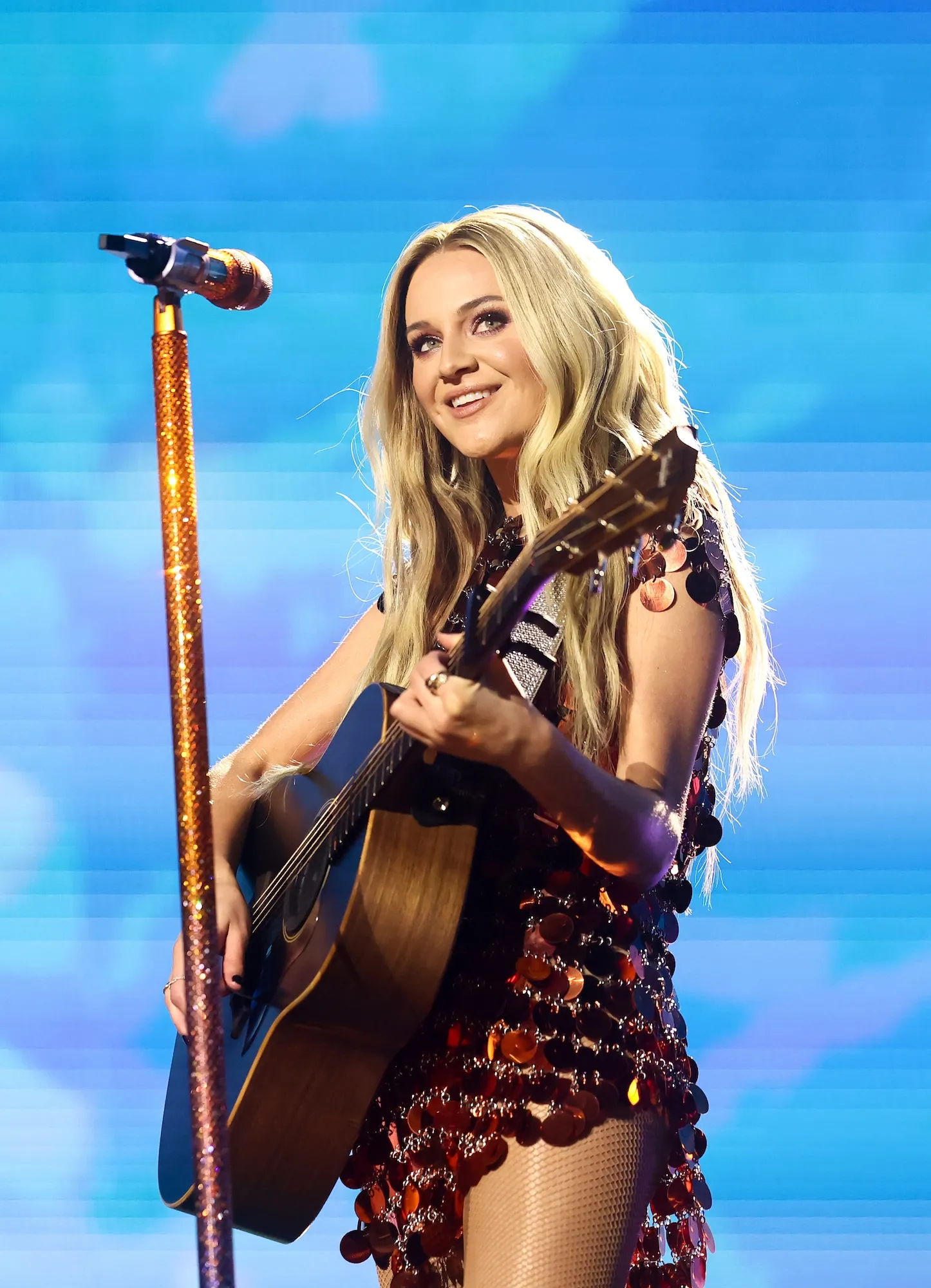 Kelsea Ballerini Accepts Bedazzed Boots From a Fan and Wears Them on Stage