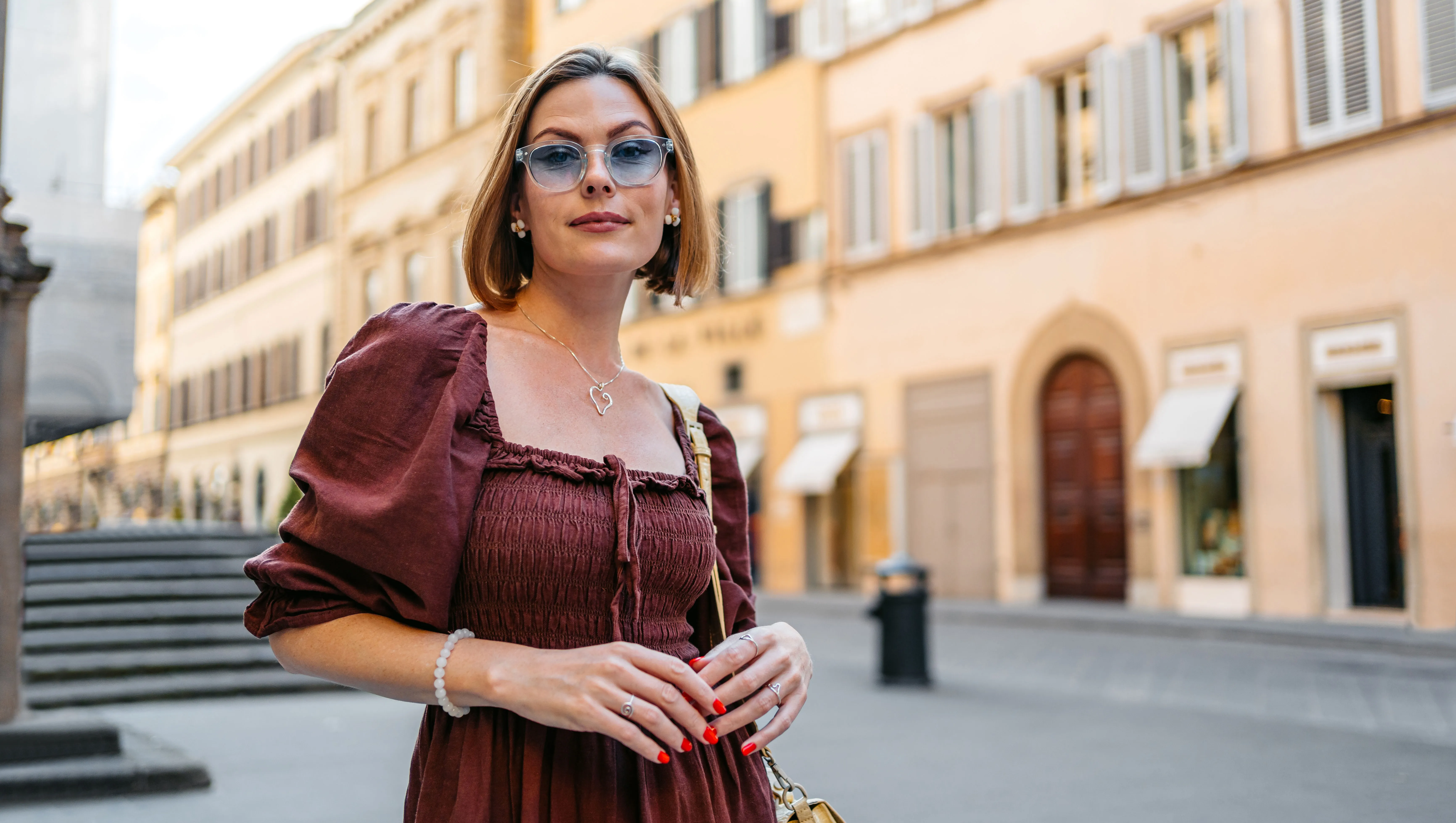 Mid-Adult Woman Standing On The Street In Florence In Italy - stock photo