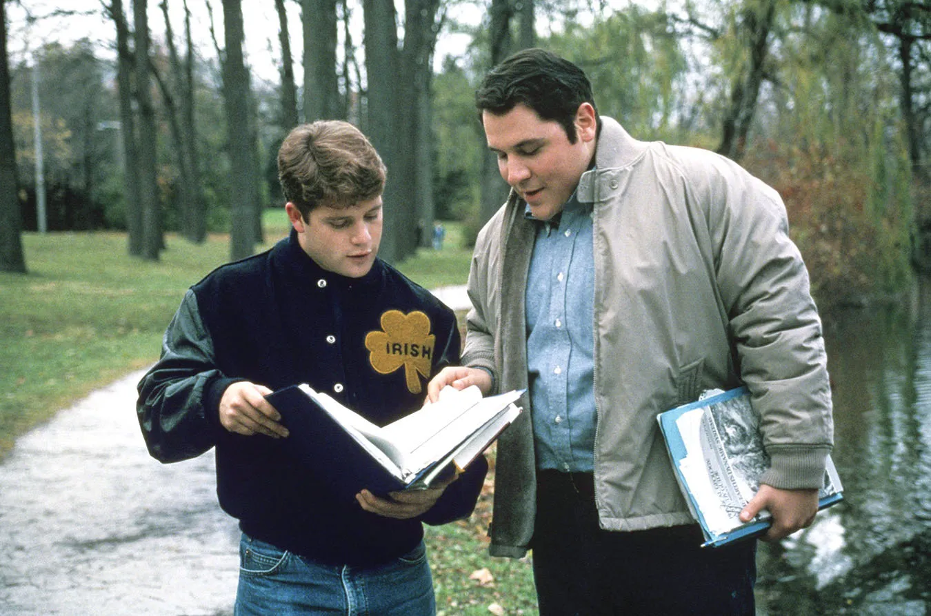 Sean Astin and Jon Favreau go over some notes in Rudy.