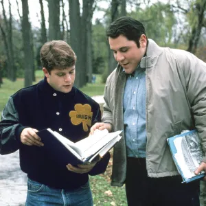 Sean Astin and Jon Favreau go over some notes in Rudy.