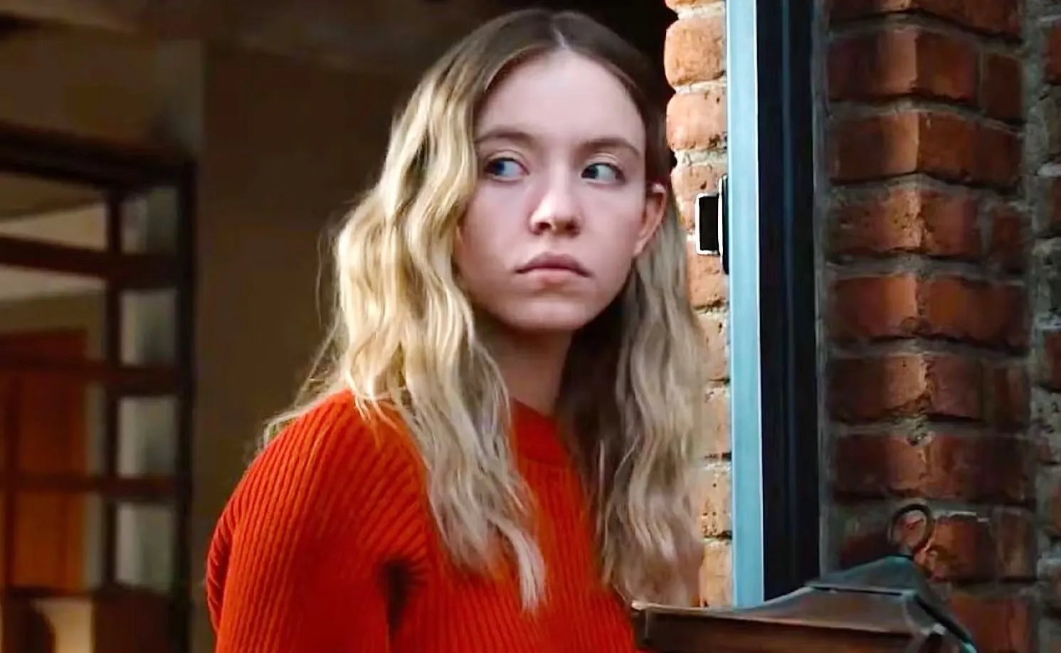 A woman looks concerned in The Voyeurs.