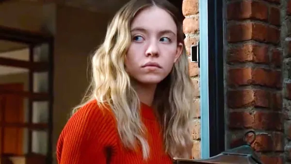 A woman looks concerned in The Voyeurs.