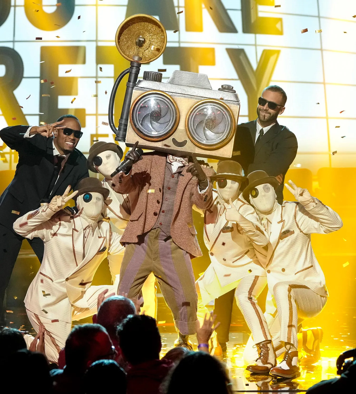 The Masked Singers Paparazzo Got Vocal Coaching From His Famous Girlfriend