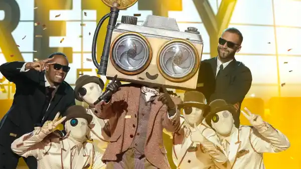 The Masked Singers Paparazzo Got Vocal Coaching From His Famous Girlfriend