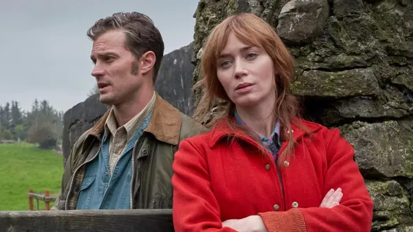 A man stands behind a woman in Wild Mountain Thyme.