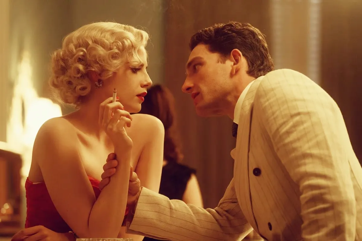 A man leans into a woman in A Cruel Love.