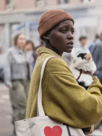 A woman holds a cat in A Quiet Place: Day One.