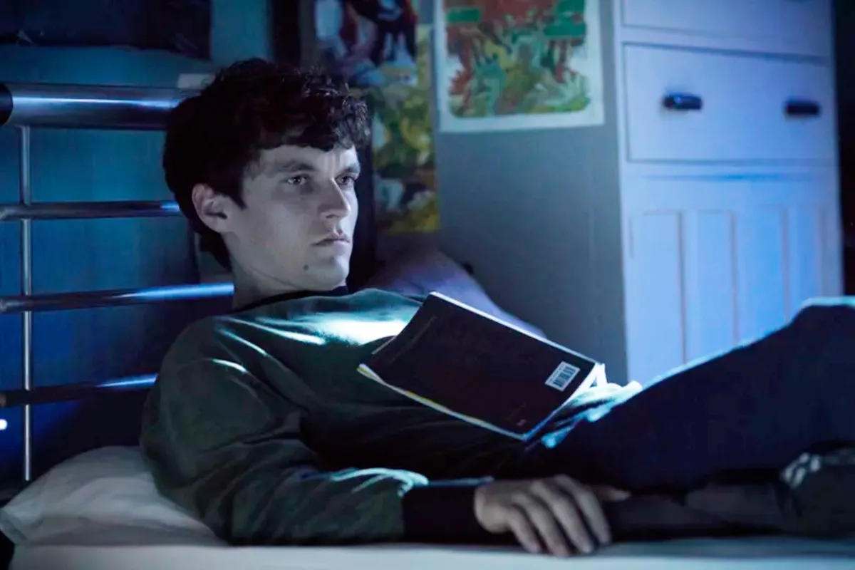 A boy lays on his bed in Bandersnatch.