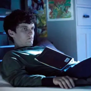 A boy lays on his bed in Bandersnatch.