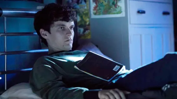 A boy lays on his bed in Bandersnatch.