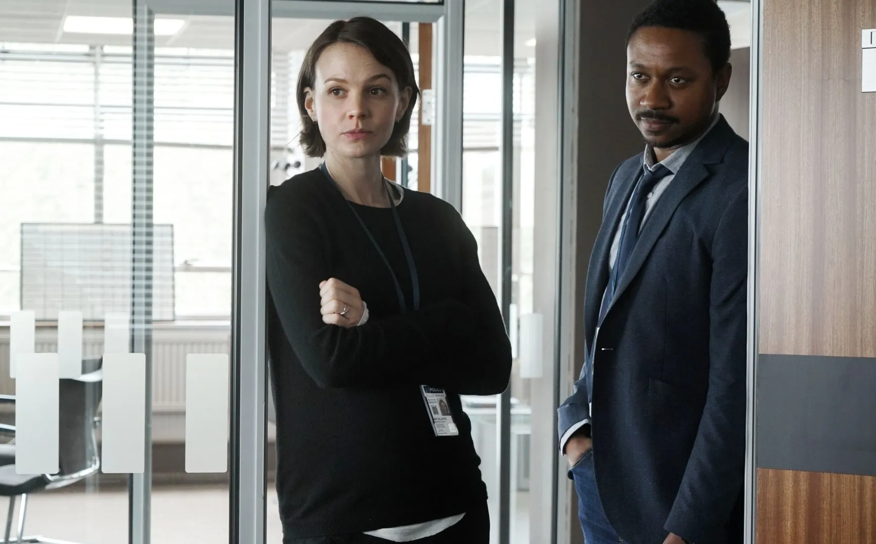 Two detectives stand in an office in Collateral.