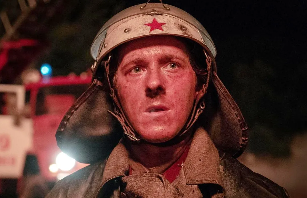 A soldier looks at the camera in Chernobyl.