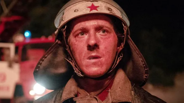 A soldier looks at the camera in Chernobyl.