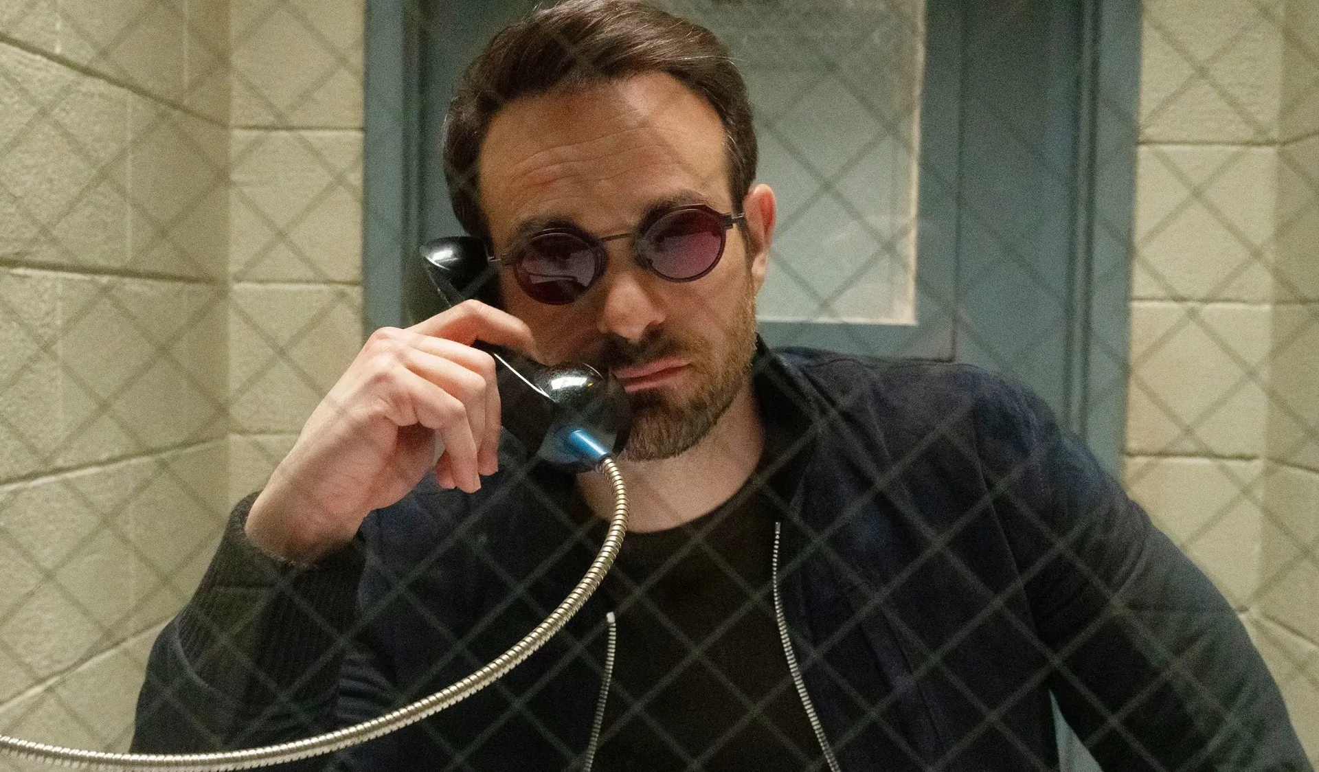 A man talks on a phone in Daredevil: Born Again.