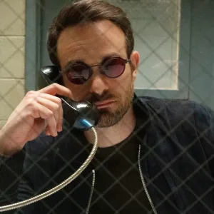 A man talks on a phone in Daredevil: Born Again.