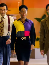 Three people walk down a hallway in Rivals.