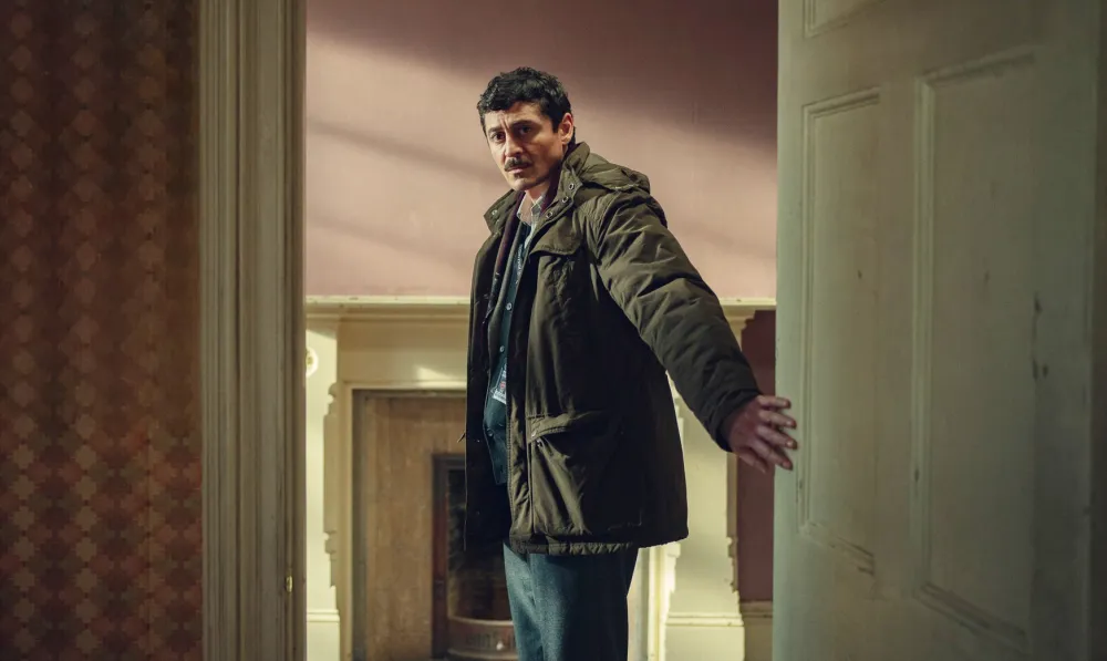 A man opens a door in Dept. Q.