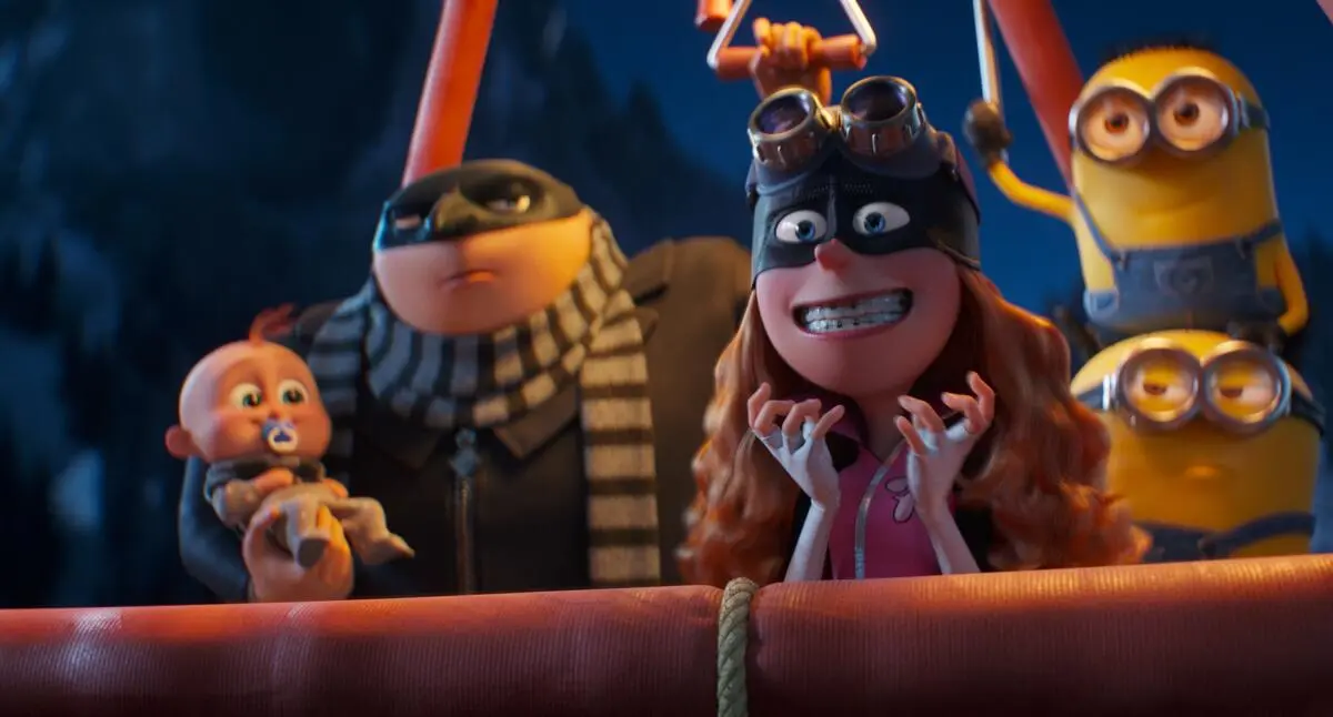 A family and some Minions stand in a hot air balloon in Despicable Me 4.