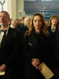 Mourners stand in a church in 'I, Jack Wright.'