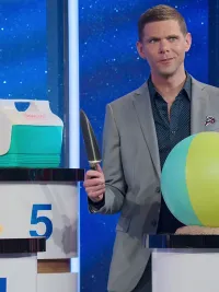 Mikey Day tries to determine which object is made of cake on 'Is It Cake?'