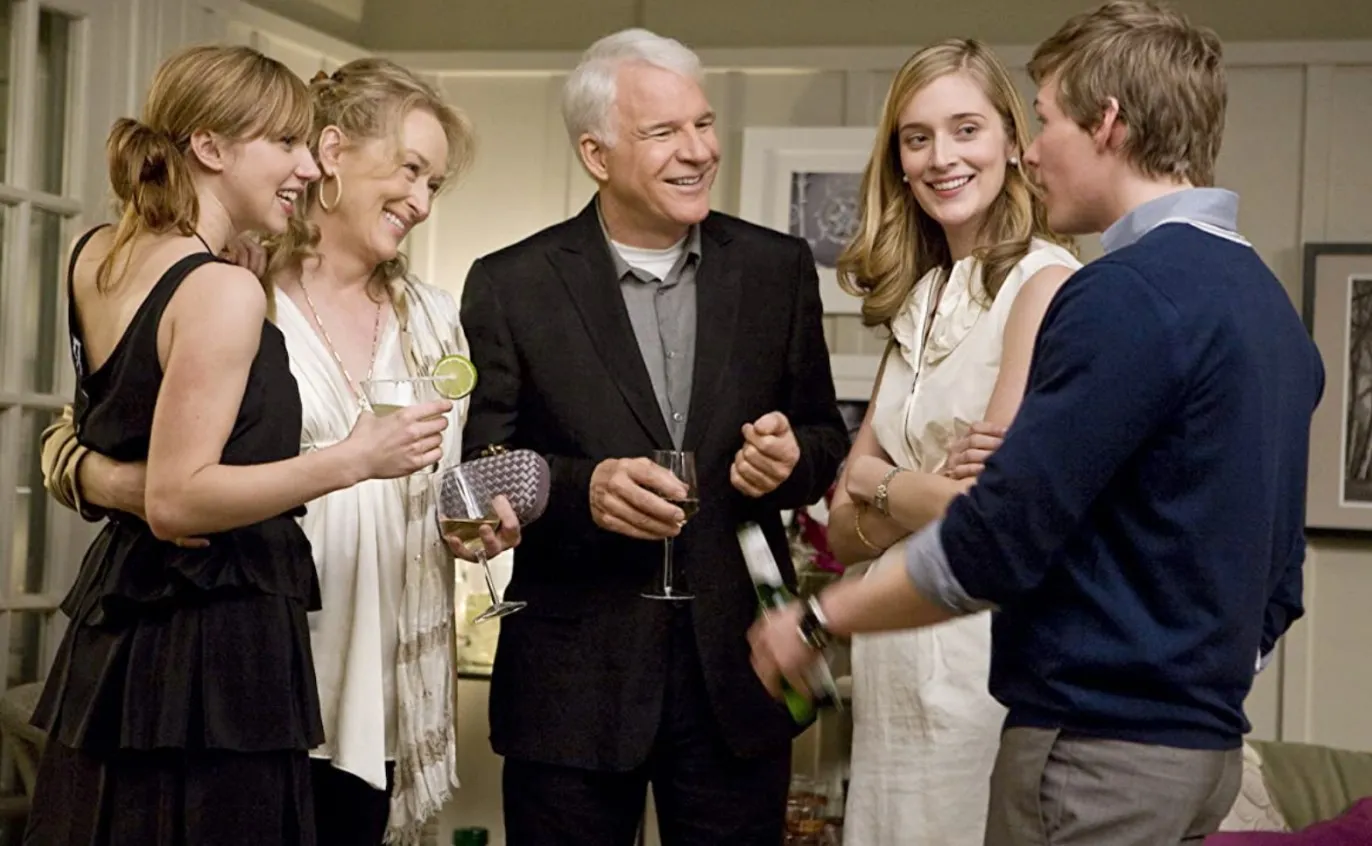 A group of people talk in It's Complicated.