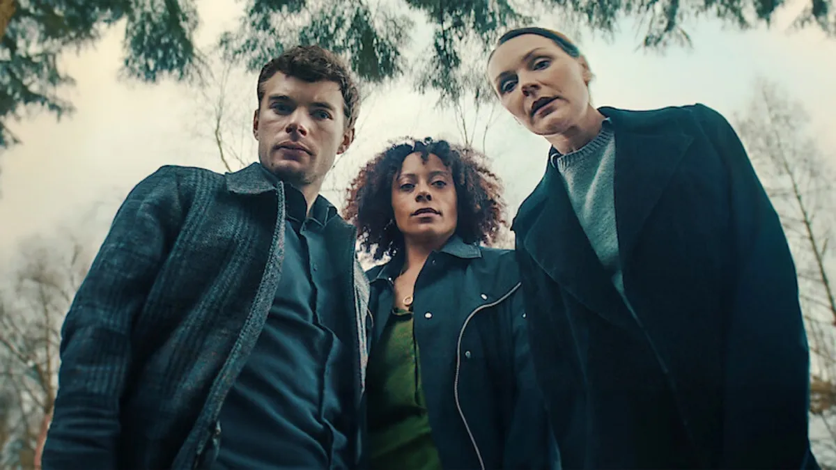 Three people look down at the camera in Missing You.