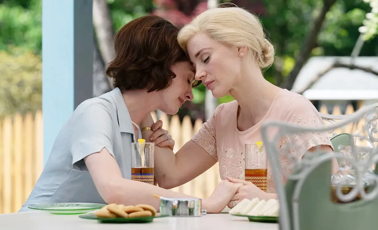 Two women lean against each other in Mothers' Instinct.