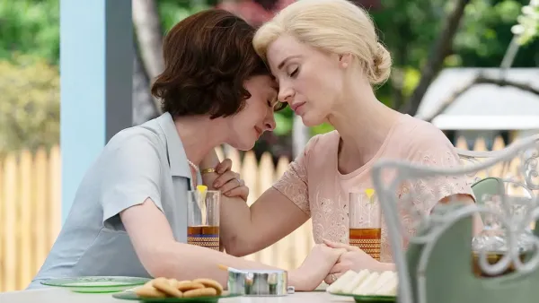 Two women lean against each other in Mothers' Instinct.