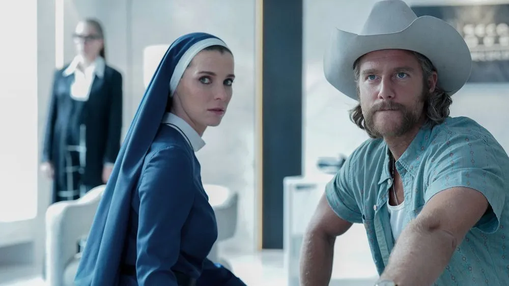 Betty Gilpin and Jake McDorman sit in Mrs. Davis.