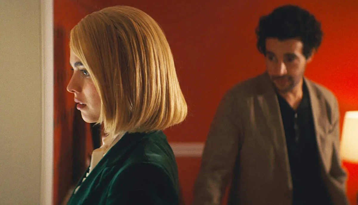 A man looks at a woman in Sanctuary.