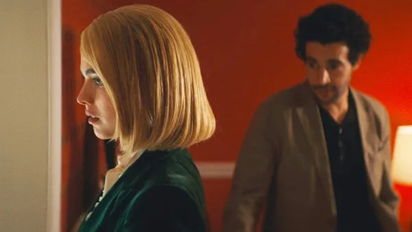 A man looks at a woman in Sanctuary.