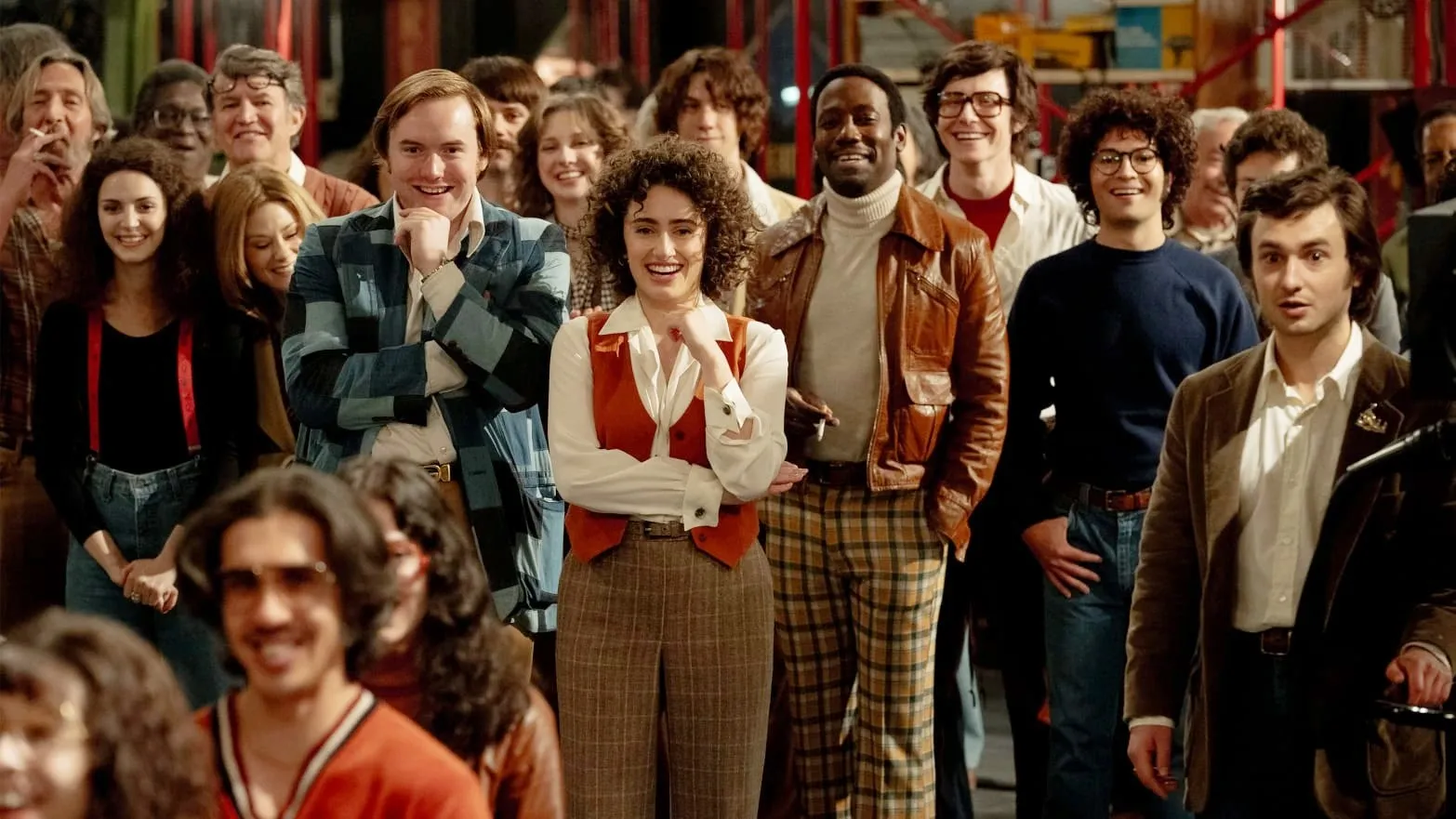 A group of people watch a skit in Saturday Night.