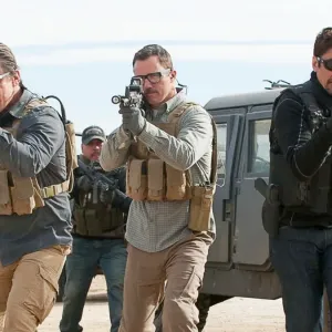 Three men aim their guns in Sicario: Day of the Soldado.