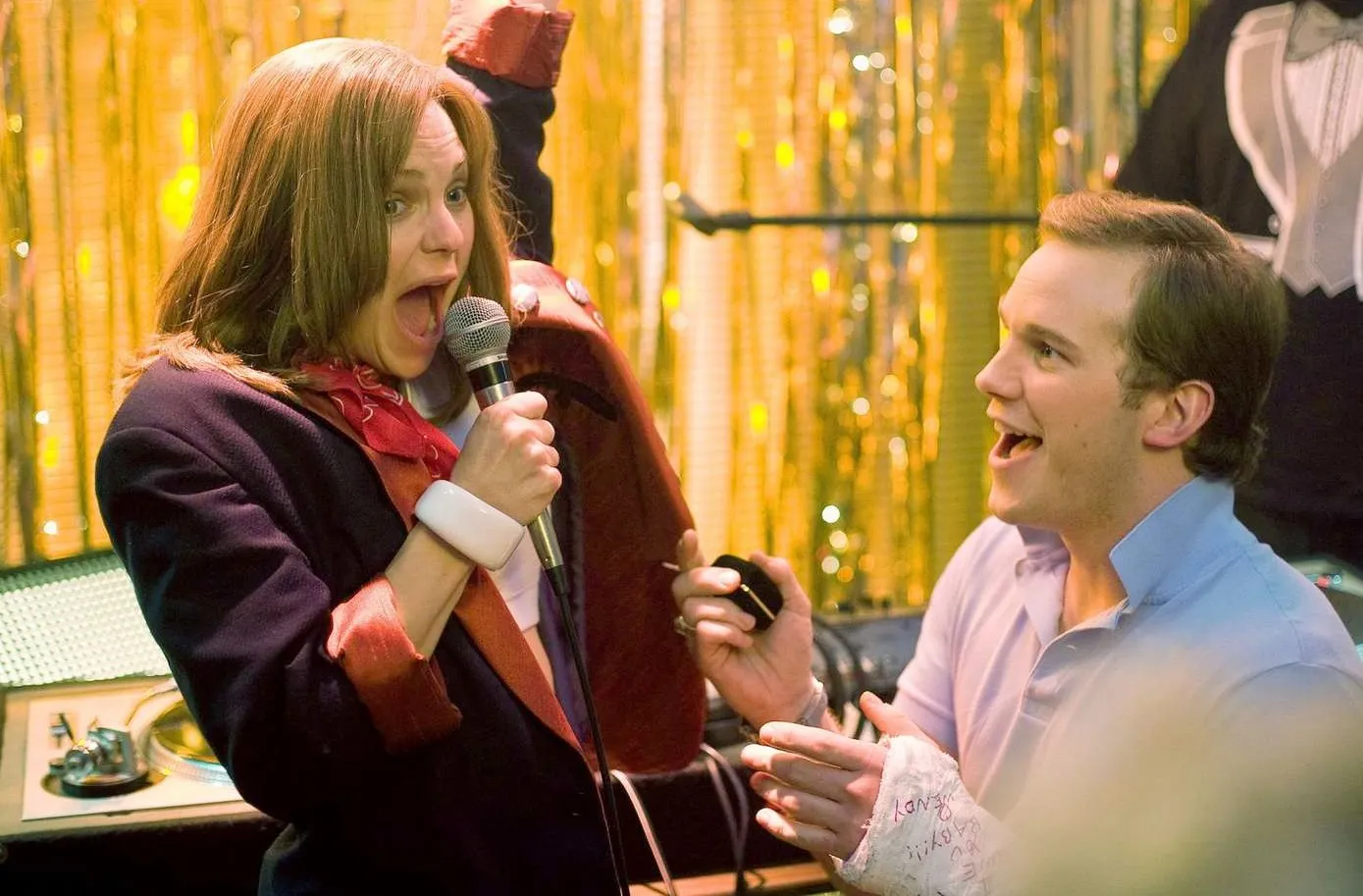 A guy looks at a girl singing in Take Me Replica Luxury Handbag Tonight.