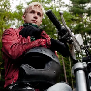 Ryan Gosling sits on a motorcycle in The Place Beyond the Pines.