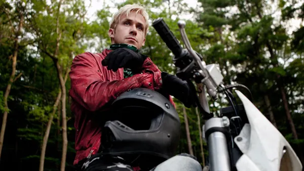 Ryan Gosling sits on a motorcycle in The Place Beyond the Pines.