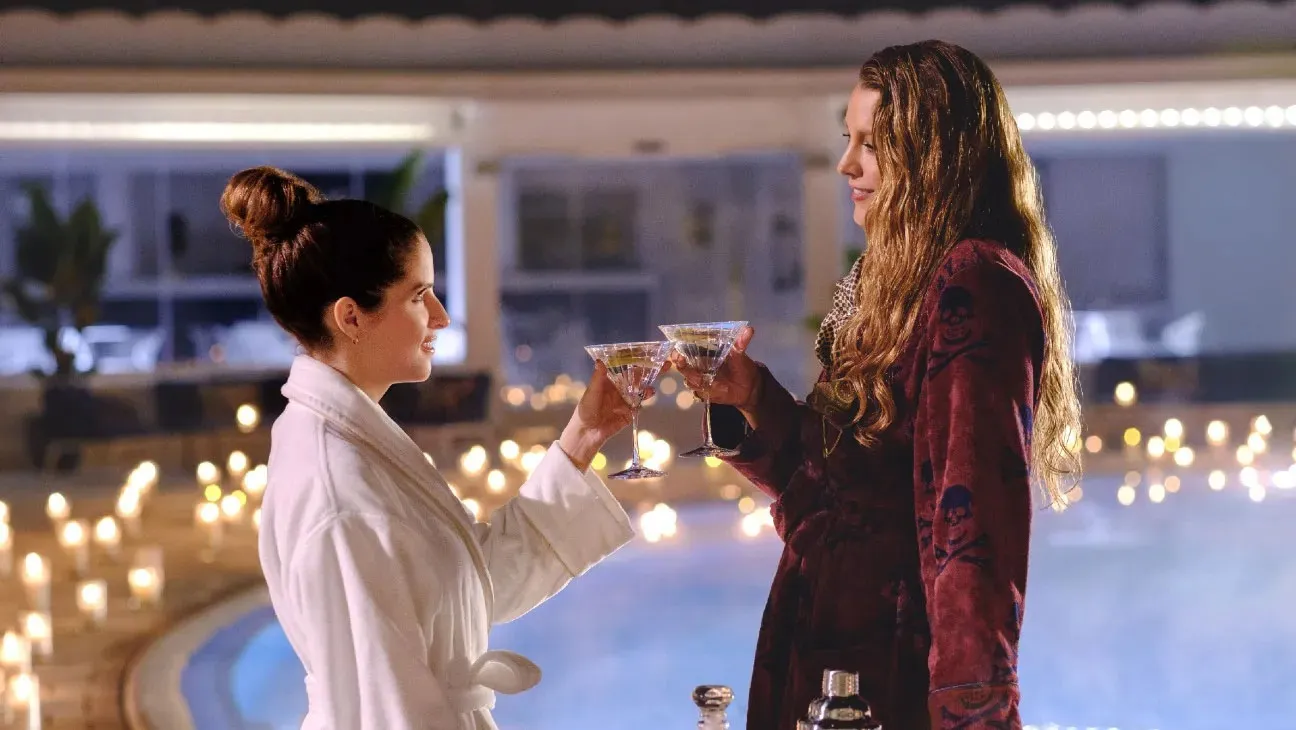 Anna Kendrick and Blake Lively share a toast in Another Simple Favor.