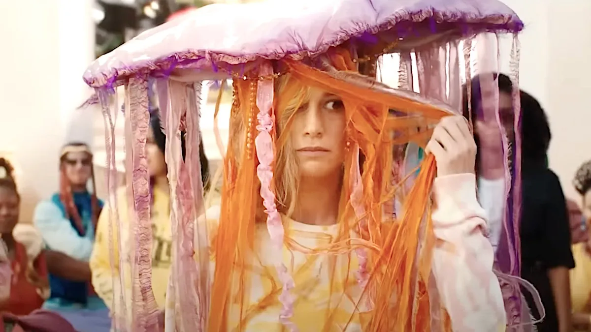 A woman wears a strange hat in 'The Marvels.'