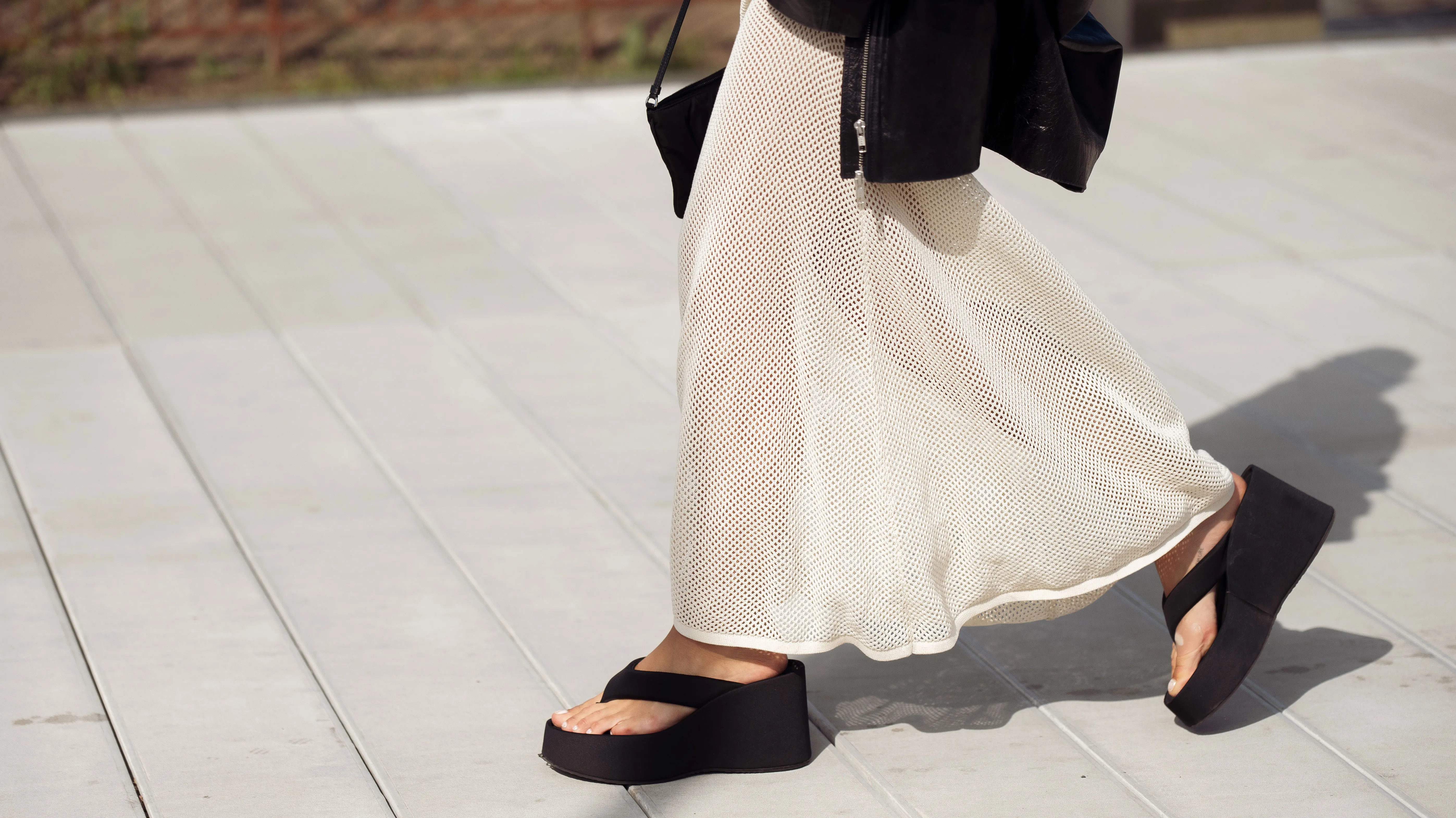 COPENHAGEN, DENMARK - AUGUST 08: Sophia Geiss wears a long beige knitted maxi dress, black flip flops, sandals, leather jacket and black bag during day four of the Copenhagen Fashion Week (CPHFW) SS25 on August 08, 2024 in Copenhagen, Denmark. (Photo by Raimonda Kulikauskiene/Getty Images)
