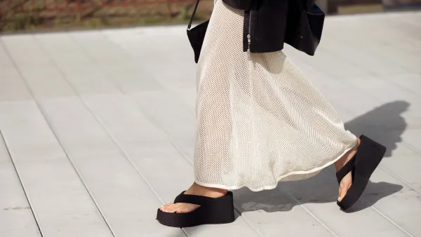 COPENHAGEN, DENMARK - AUGUST 08: Sophia Geiss wears a long beige knitted maxi dress, black flip flops, sandals, leather jacket and black bag during day four of the Copenhagen Fashion Week (CPHFW) SS25 on August 08, 2024 in Copenhagen, Denmark. (Photo by Raimonda Kulikauskiene/Getty Images)