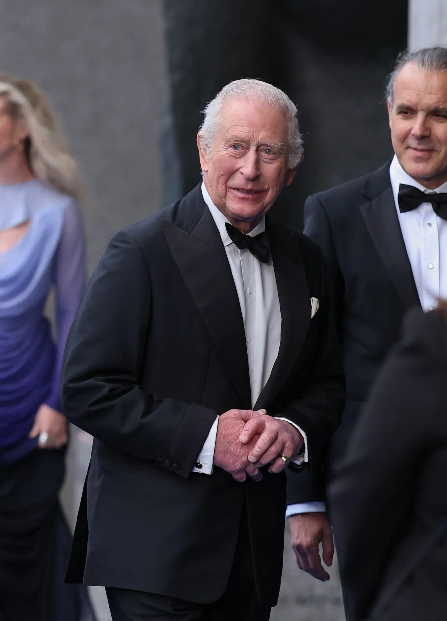King Charles Is All Smiles in Tuxedo at Premiere Amid Mounting Prince Harry Feud