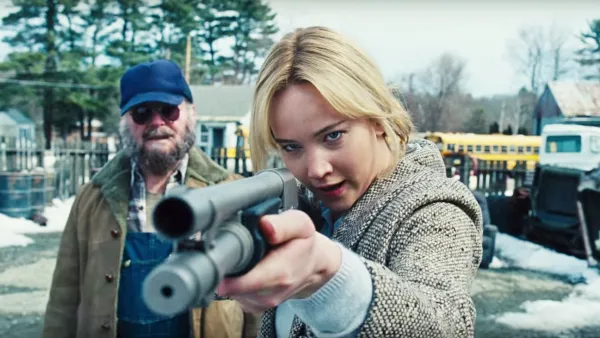 A woman aims a shotgun in 'Joy.'