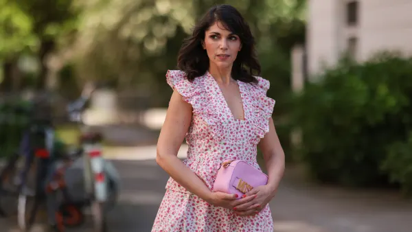 HAMBURG, GERMANY - MAY 31: Anna Wolfers wearing white and pink ruffle dress via Goldig Shop, pink Moschino clutch and pink heels on May 31, 2021 in Hamburg, Germany. (Photo by Jeremy Moeller/Getty Images)