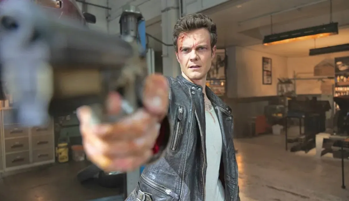 A man aims his gun in 'Novocaine.'