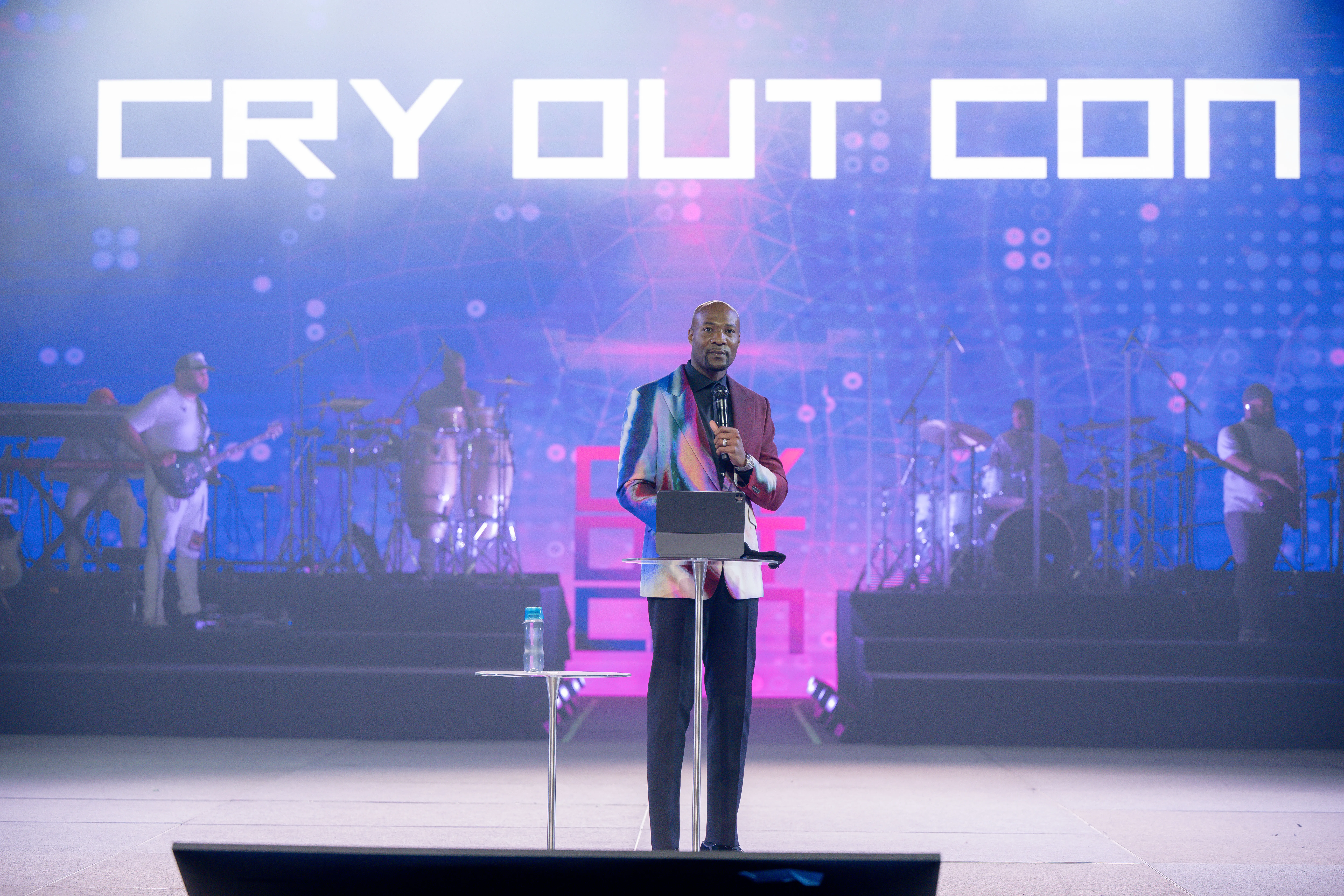 Pastor Keion Henderson speaks onstage during day 1 of Cry Out Con