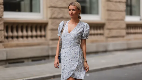 DUSSELDORF, GERMANY - AUGUST 07: Scarlett Gartmann wearing Neo Noir flower mini dress and Majavia blue bag on August 07, 2021 in Dusseldorf, Germany. (Photo by Jeremy Moeller/Getty Images)